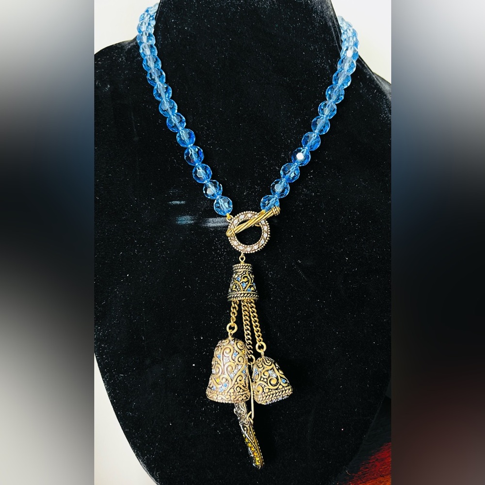 Heidi Daus “Boho Charm” vintage blue faceted toggle necklace with charms